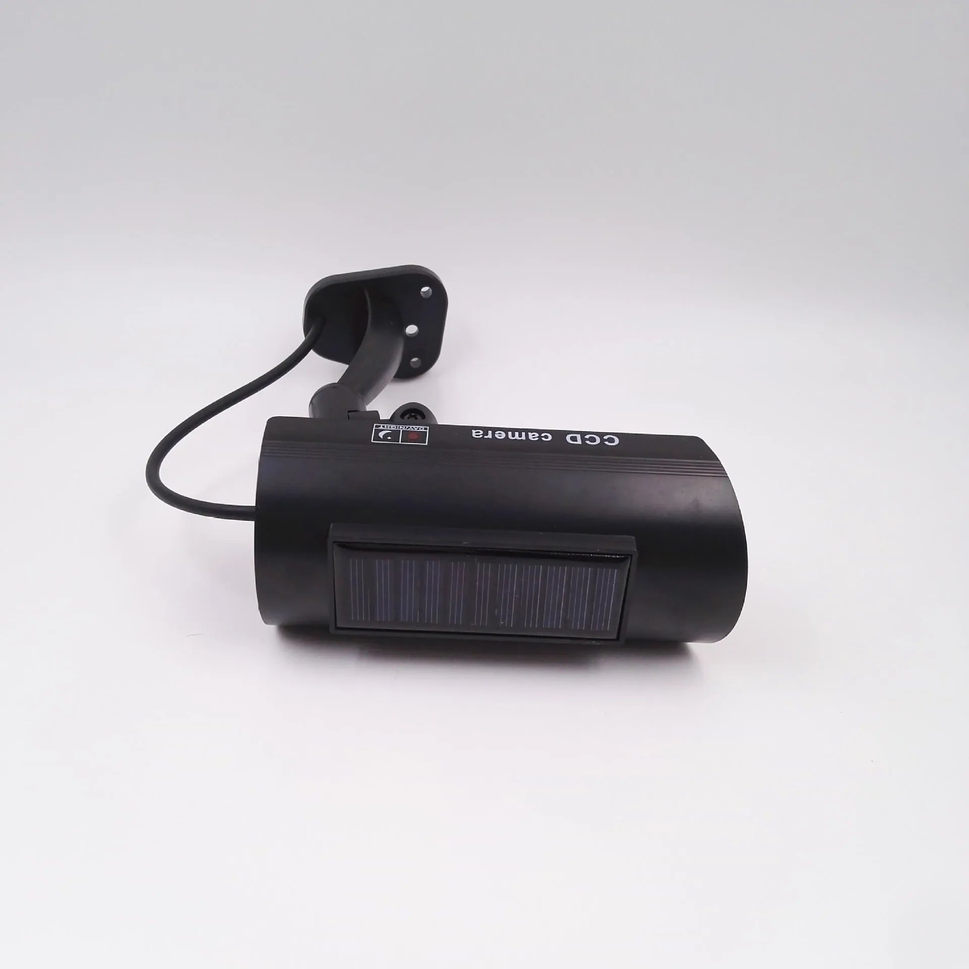 Black plastic fake security camera with gun-style design and solar simulation LED light