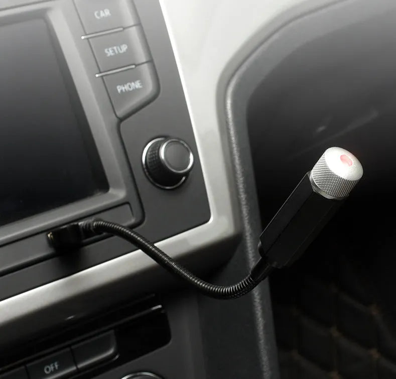 USB-powered car interior star light projecting purple starry sky pattern onto vehicle roof lining