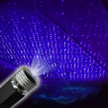 USB-powered car interior star light projecting purple starry sky pattern onto vehicle roof lining