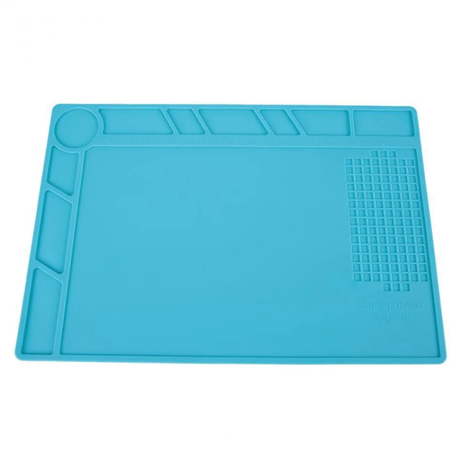 Blue silicone watch repair table mat with a non-slip surface for securing small components.