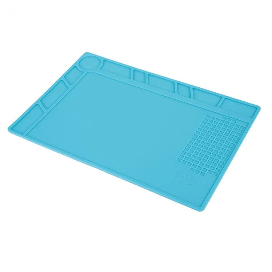 Blue silicone watch repair table mat with a non-slip surface for securing small components.
