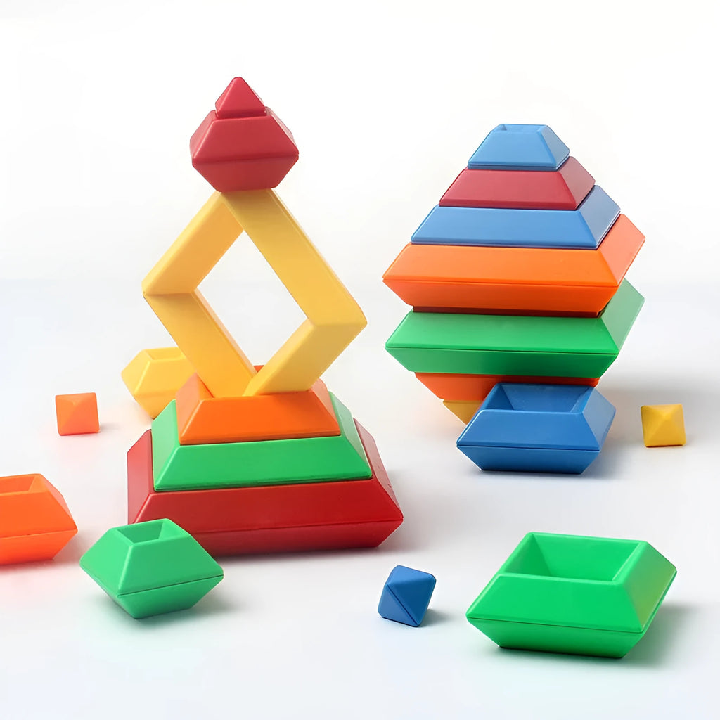 Rainbow-coloured wooden jenga-style building blocks forming three towers for children's educational play