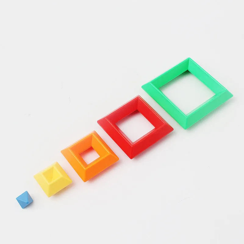 Rainbow-coloured wooden jenga-style building blocks forming three towers for children's educational play