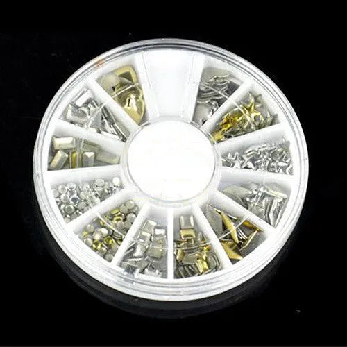 Gold acrylic nail art stickers on a finger showing decorative self-adhesive design