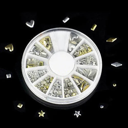 Gold acrylic nail art stickers on a finger showing decorative self-adhesive design