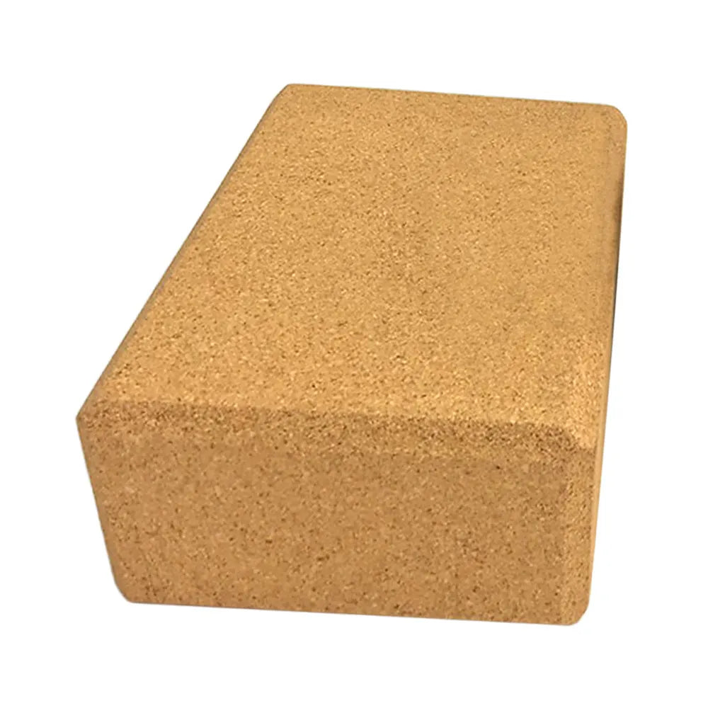Yellow cork yoga brick with beveled edges and nonslip surface, size 24x16x8.5cm, on a plain background