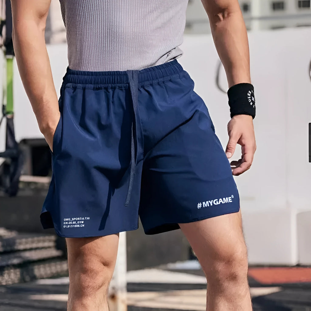Men's grey quick-dry fitness shorts with high elasticity for summer training workouts.