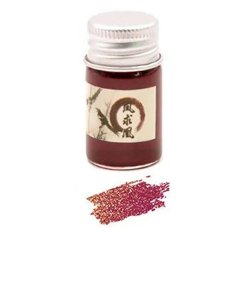 Set of six small glass bottles of gold powder dipping pen ink in different colours.