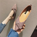 Women's pointed toe shallow mouth shoes in red and black with a low flat heel.