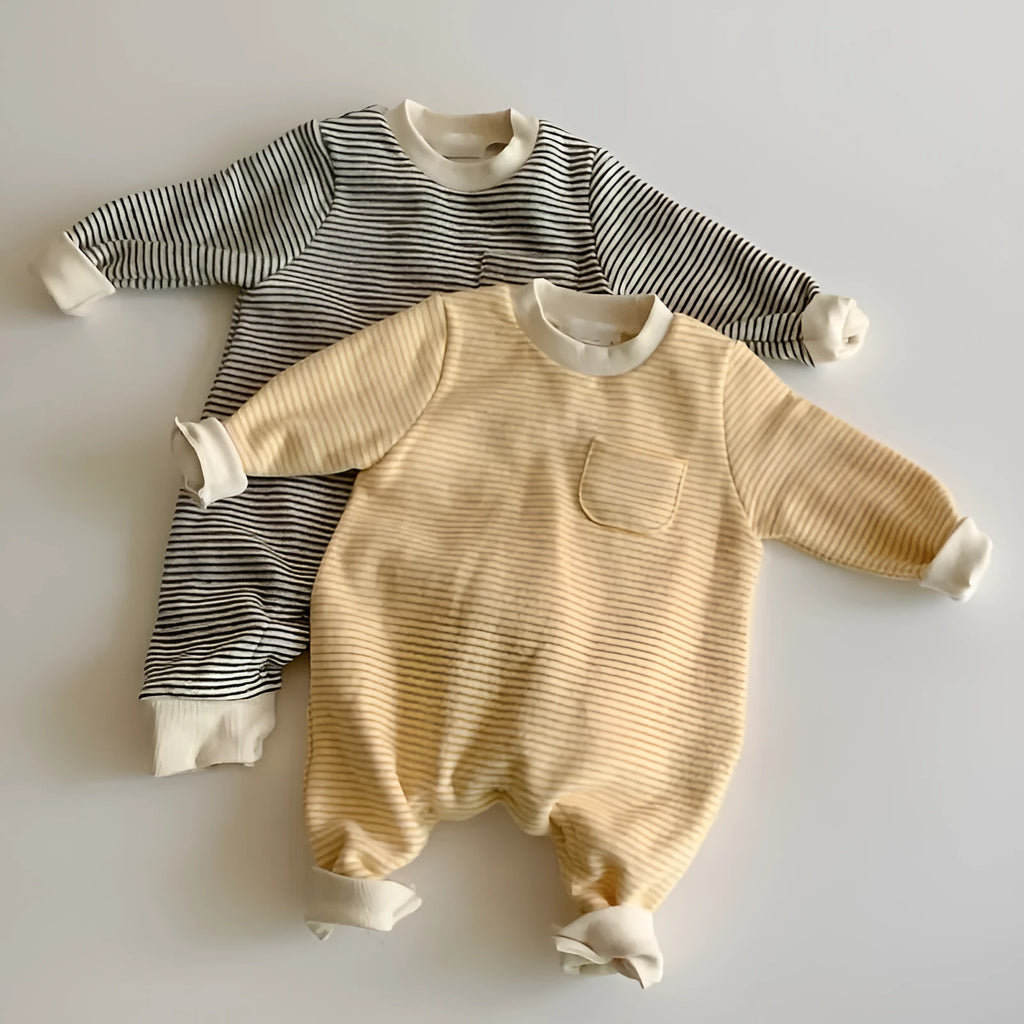 Yellow and black striped fleece-lined cotton baby jumpsuit with long sleeves on a hanger.