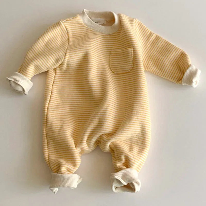 Yellow and black striped fleece-lined cotton baby jumpsuit with long sleeves on a hanger.