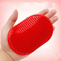 Oval rubber pet bath brush for dogs and cats, available in red or blue, hand cover massage brush