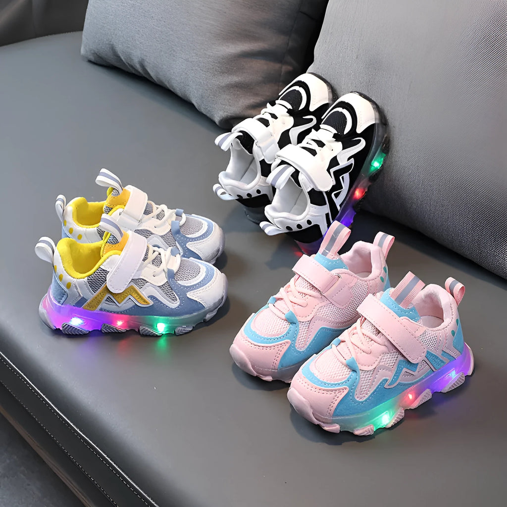 Children's black breathable mesh sneakers with a Velcro fastening strap and rubber sole.