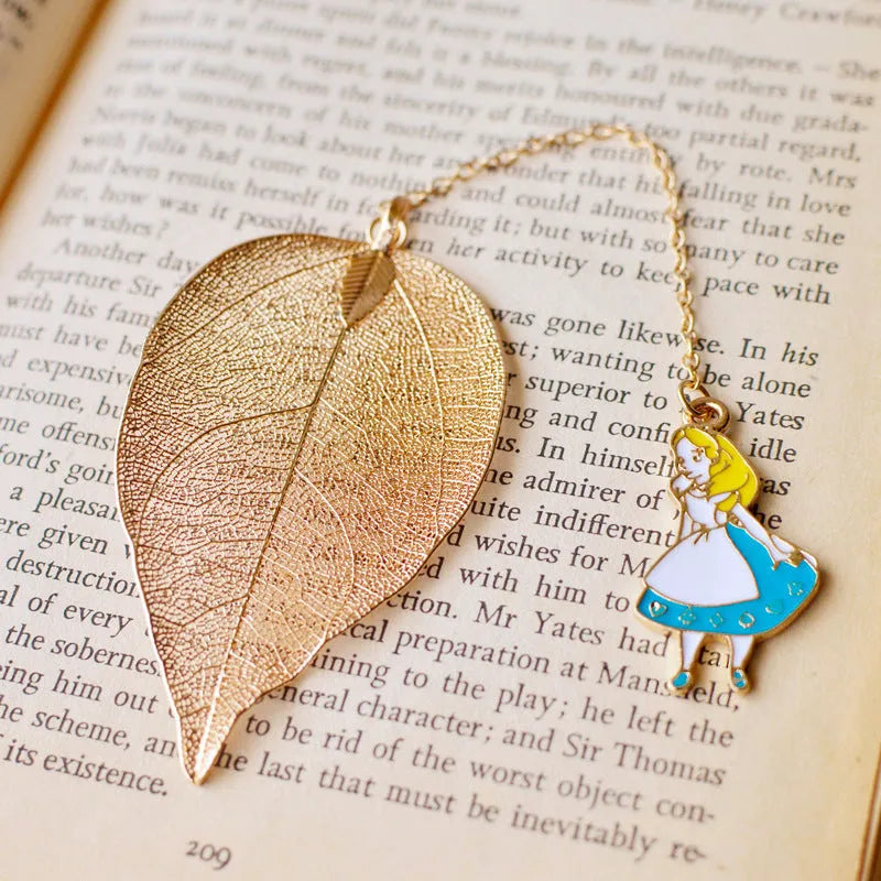 KC alloy leaf-shaped bookmark with a choice of Alice, rabbit, or clock charm attachment.