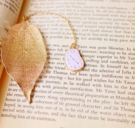 KC alloy leaf-shaped bookmark with a choice of Alice, rabbit, or clock charm attachment.