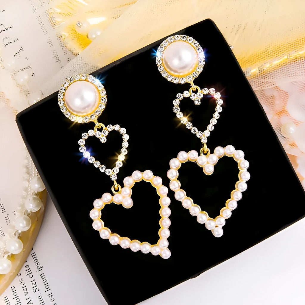Pair of gold pearl rhinestone drop earrings on a plain background, measuring 7x2.5cm