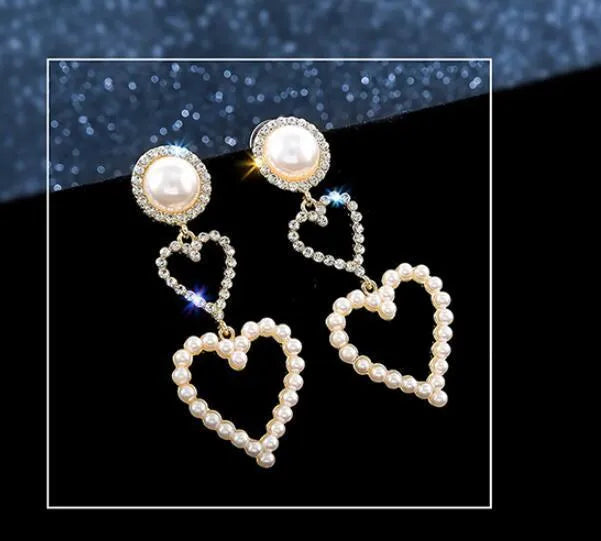 Pair of gold pearl rhinestone drop earrings on a plain background, measuring 7x2.5cm