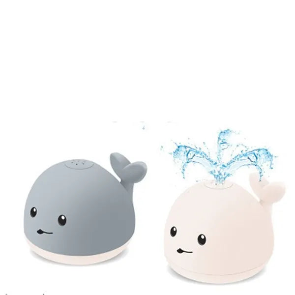 Colourful whale-shaped bath toy spraying water with LED lights illuminated