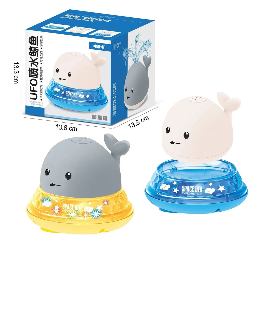Colourful whale-shaped bath toy spraying water with LED lights illuminated