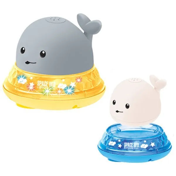 Colourful whale-shaped bath toy spraying water with LED lights illuminated