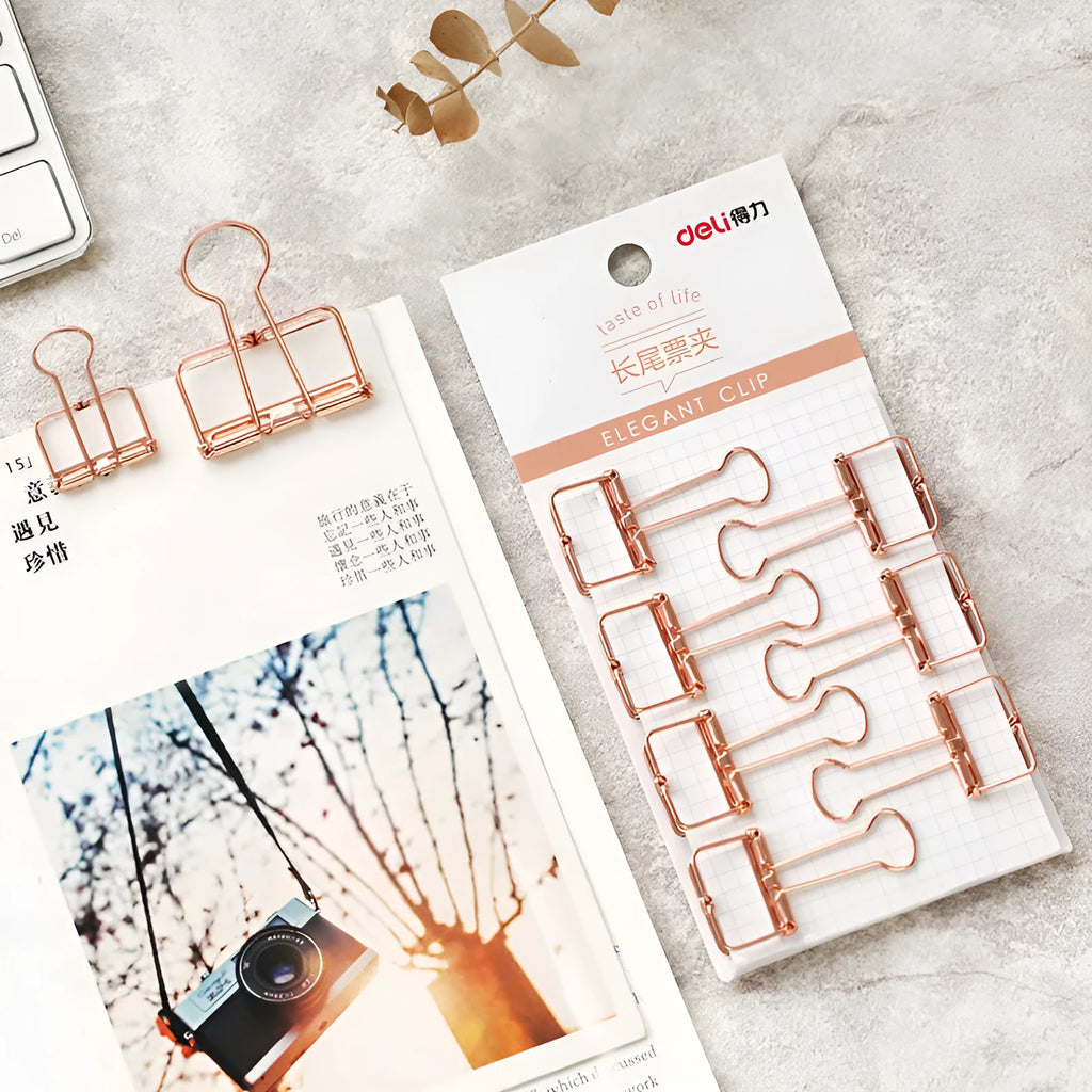 Rose gold metal binder set showing large and small folders with metal rings for tickets and papers.
