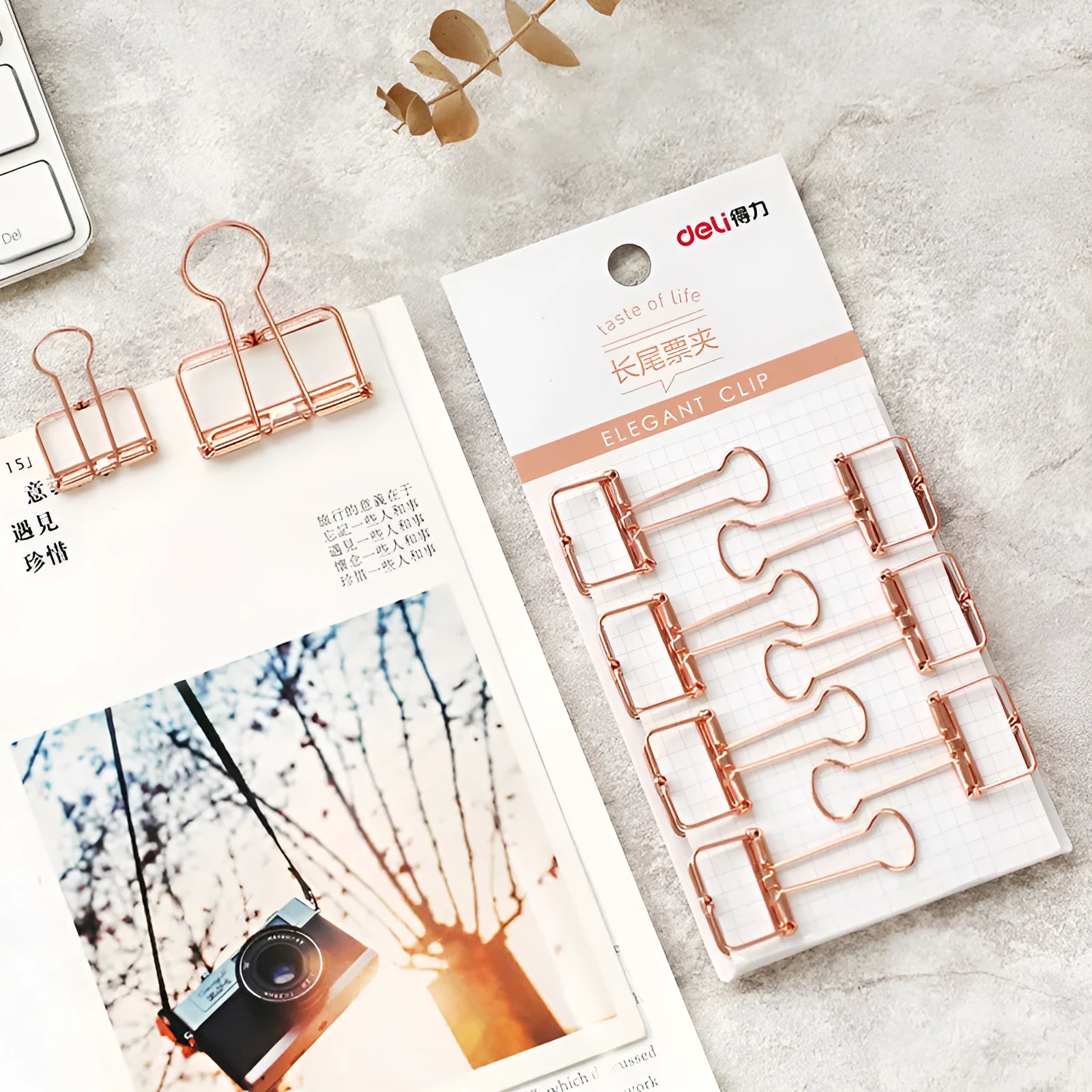 Rose gold metal binder set showing large and small folders with metal rings for tickets and papers.
