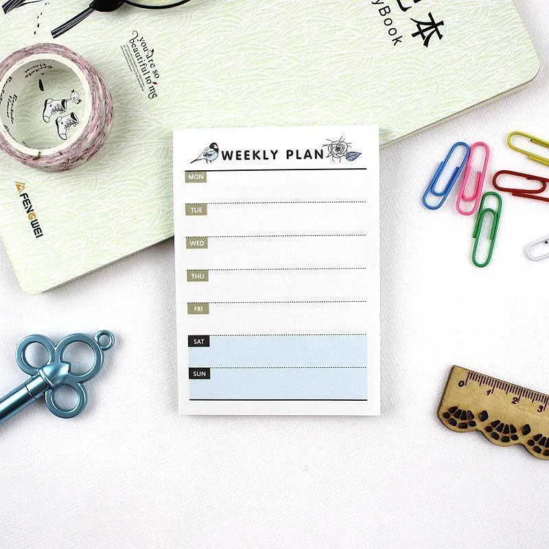 Compact 10.2x7.2cm work plan diary open showing weekly monthly planning pages