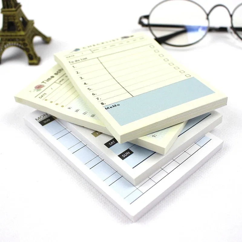 Compact 10.2x7.2cm work plan diary open showing weekly monthly planning pages