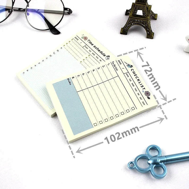 Compact 10.2x7.2cm work plan diary open showing weekly monthly planning pages