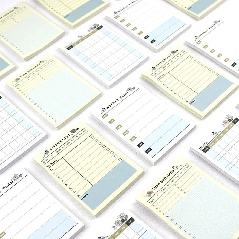 Compact 10.2x7.2cm work plan diary open showing weekly monthly planning pages