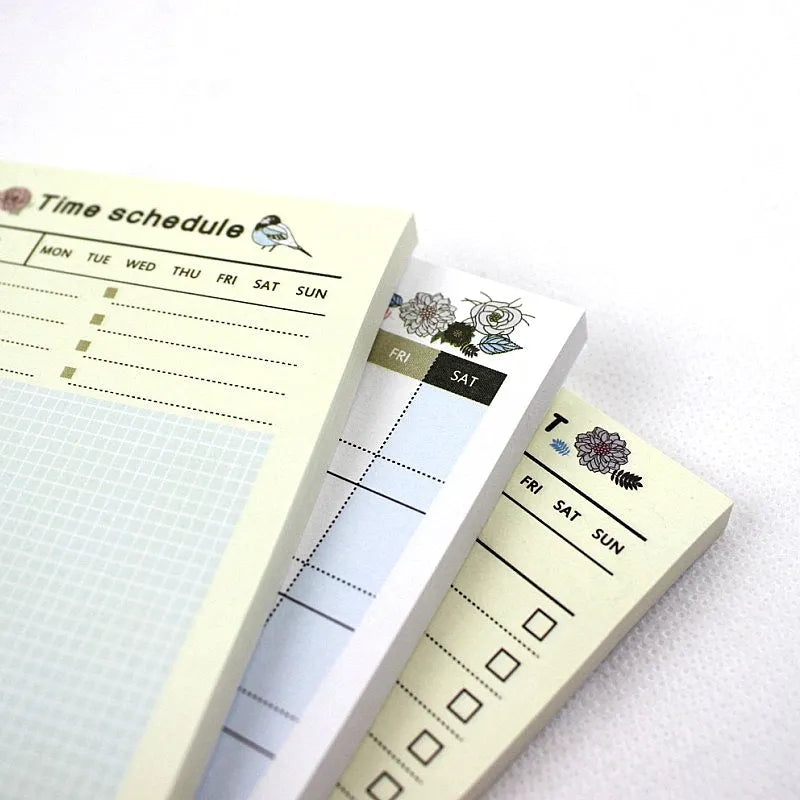 Compact 10.2x7.2cm work plan diary open showing weekly monthly planning pages