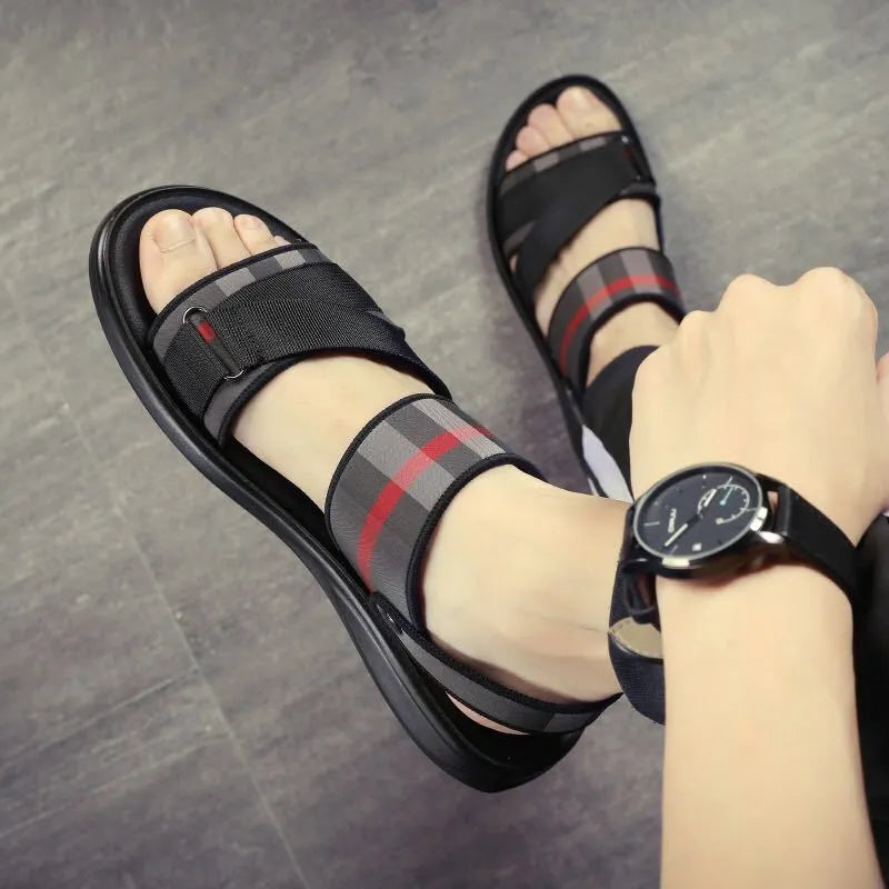 Youth leisure sports sandals with blue Lycra upper and textured polyurethane sole.
