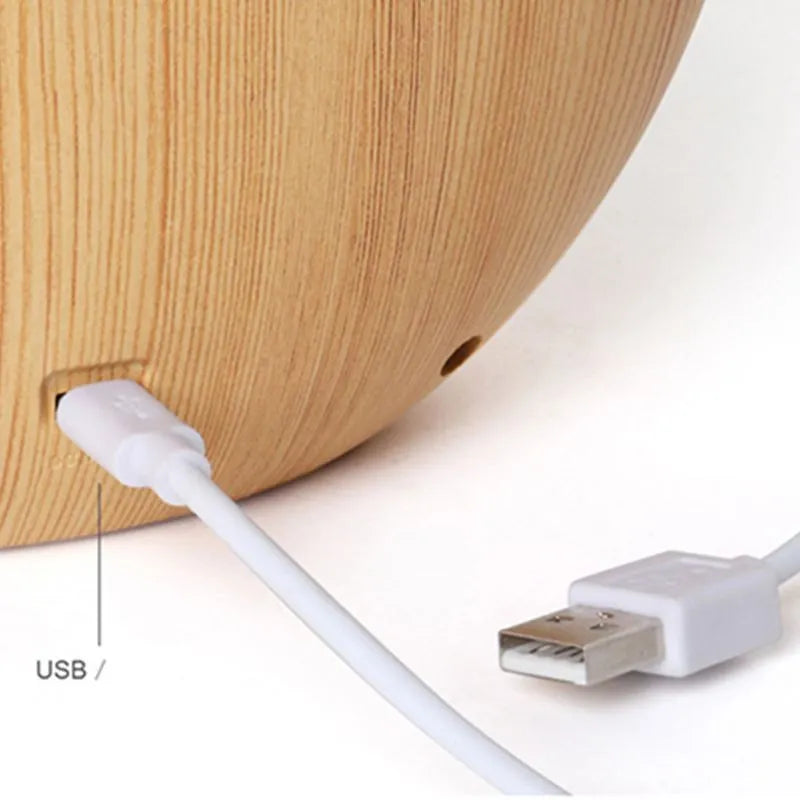 Creative hidden moon light LED table lamp with ABS shade in blue colour on a bedside table