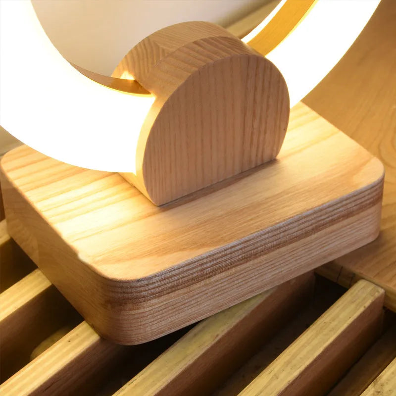 Modern circular acrylic LED chandelier in Nordic style, shown in a living room setting.
