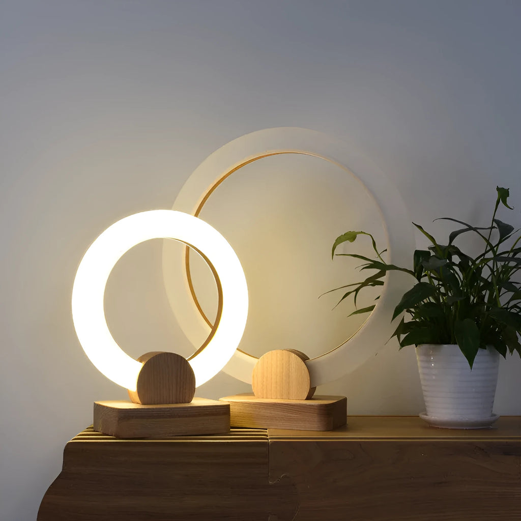 Modern circular acrylic LED chandelier in Nordic style, shown in a living room setting.