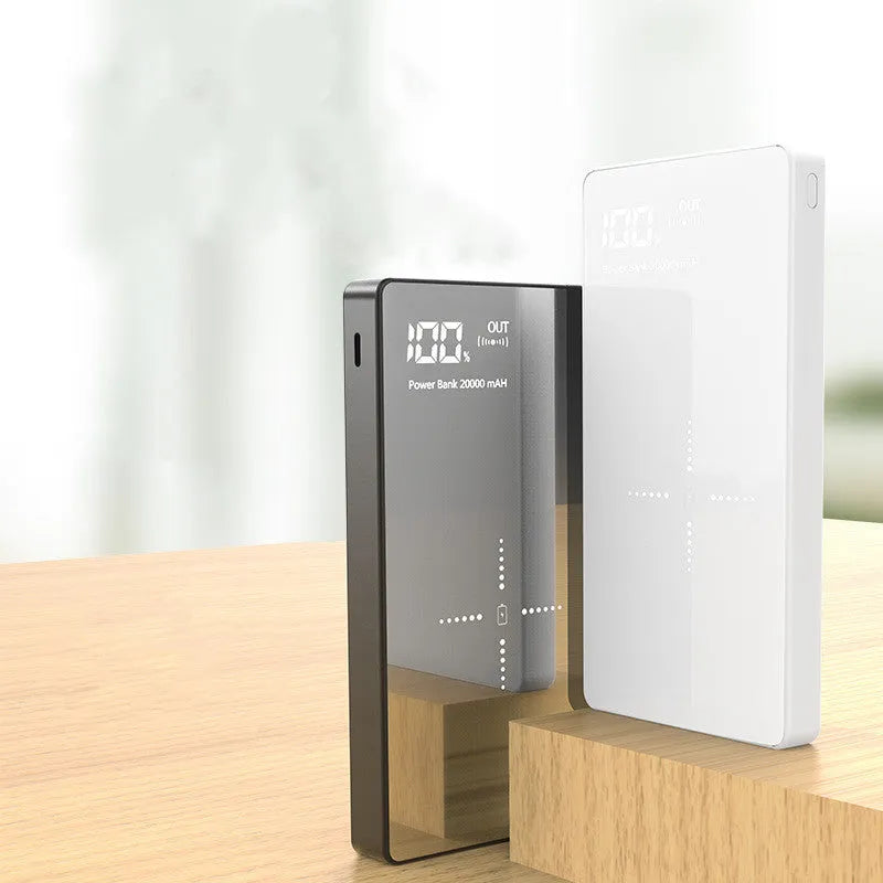 Black wireless charging power bank with digital display showing battery percentage, measuring 73mm x 153mm x 22mm.