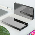 Black wireless charging power bank with digital display showing battery percentage, measuring 73mm x 153mm x 22mm.