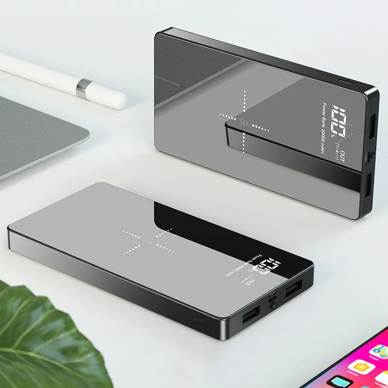 Black wireless charging power bank with digital display showing battery percentage, measuring 73mm x 153mm x 22mm.