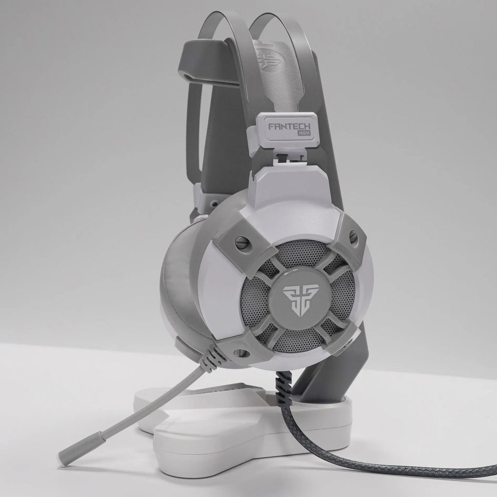 Black FANTECH HG11 USB gaming headset with large ear cups, RGB lighting, and a cable with inline remote control.