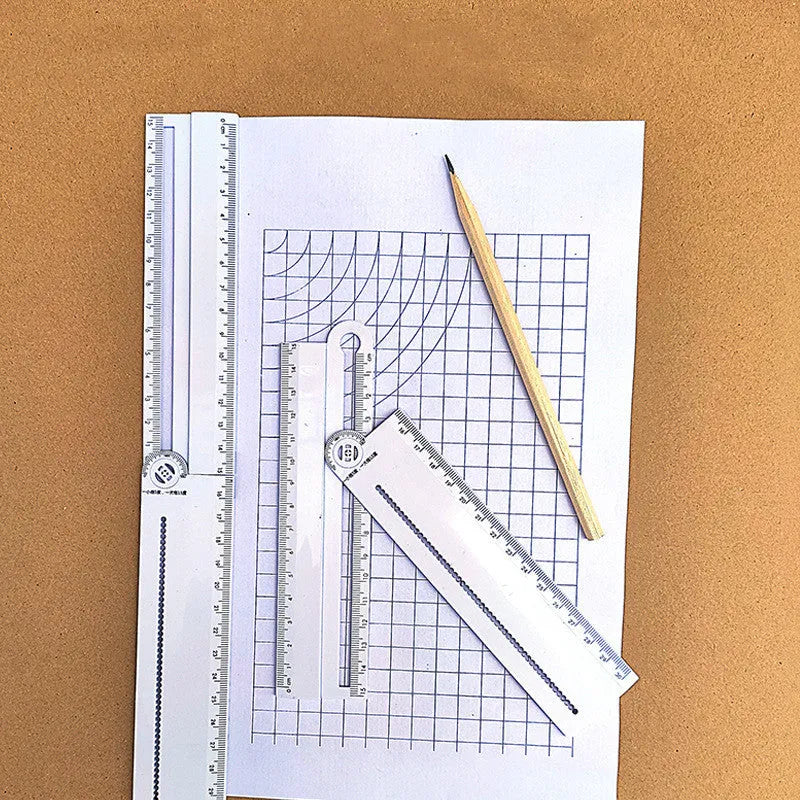 White plastic multi-function ruler measuring 30cm in length.