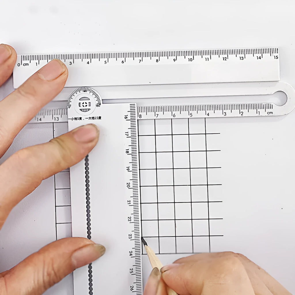 White plastic multi-function ruler measuring 30cm in length.