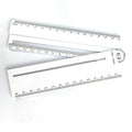 White plastic multi-function ruler measuring 30cm in length.