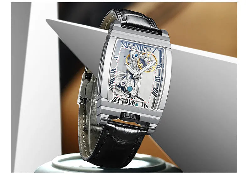 Daystar square stainless steel watch with mechanical movement on a leather strap, showing white dial and case.