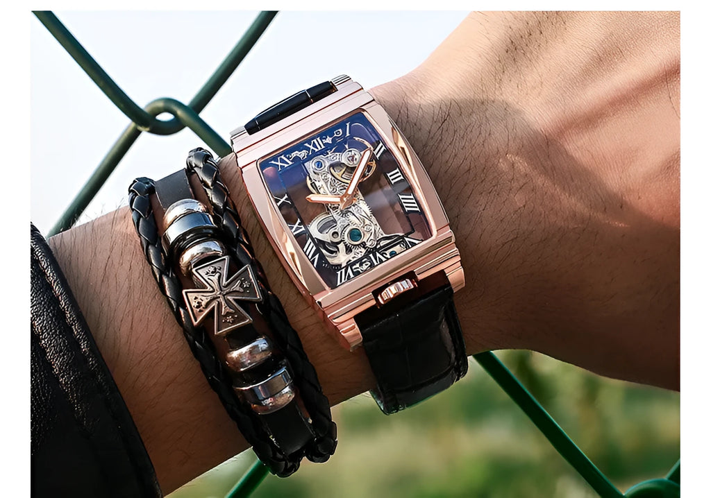 Daystar square stainless steel watch with mechanical movement on a leather strap, showing white dial and case.