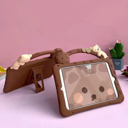 Brown cartoon-style silicone sleeve case for iPad tablets on a flat surface.