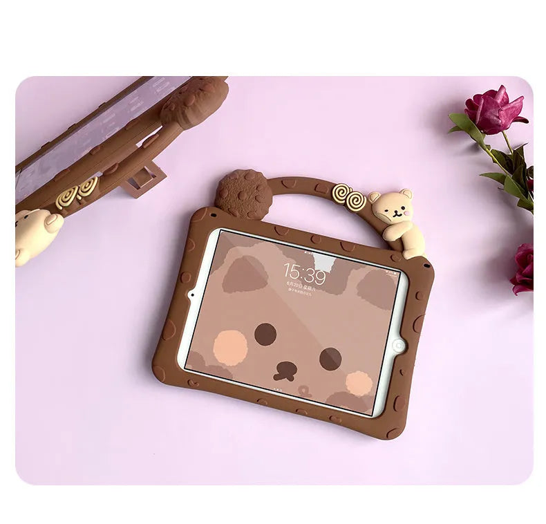 Brown cartoon-style silicone sleeve case for iPad tablets on a flat surface.