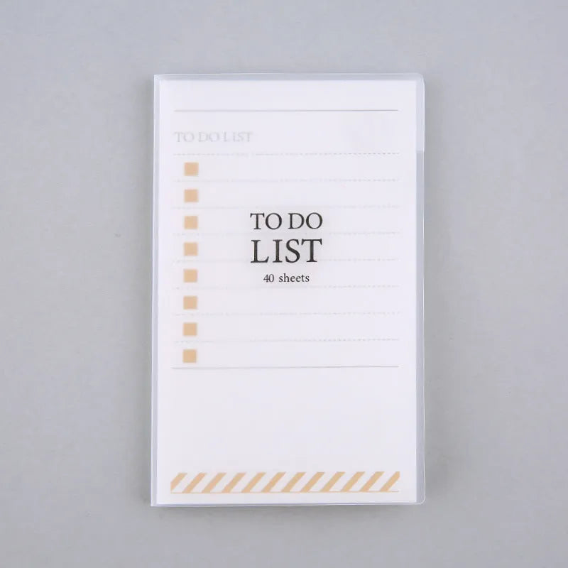 Small yellow frosted PP notebook with tearable pages, shown next to a pen for scale.