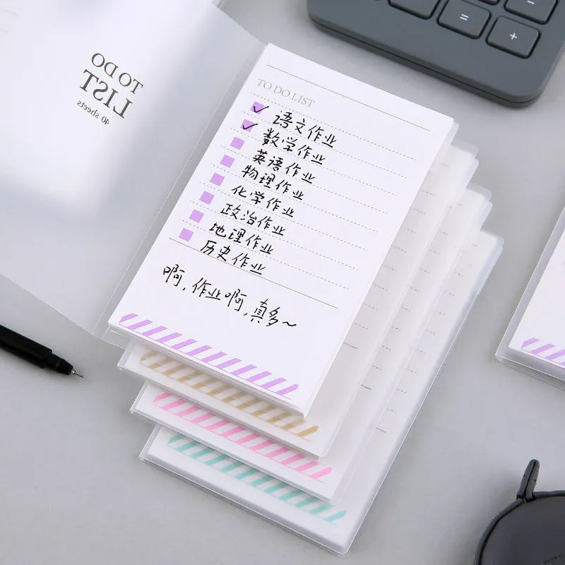 Small yellow frosted PP notebook with tearable pages, shown next to a pen for scale.
