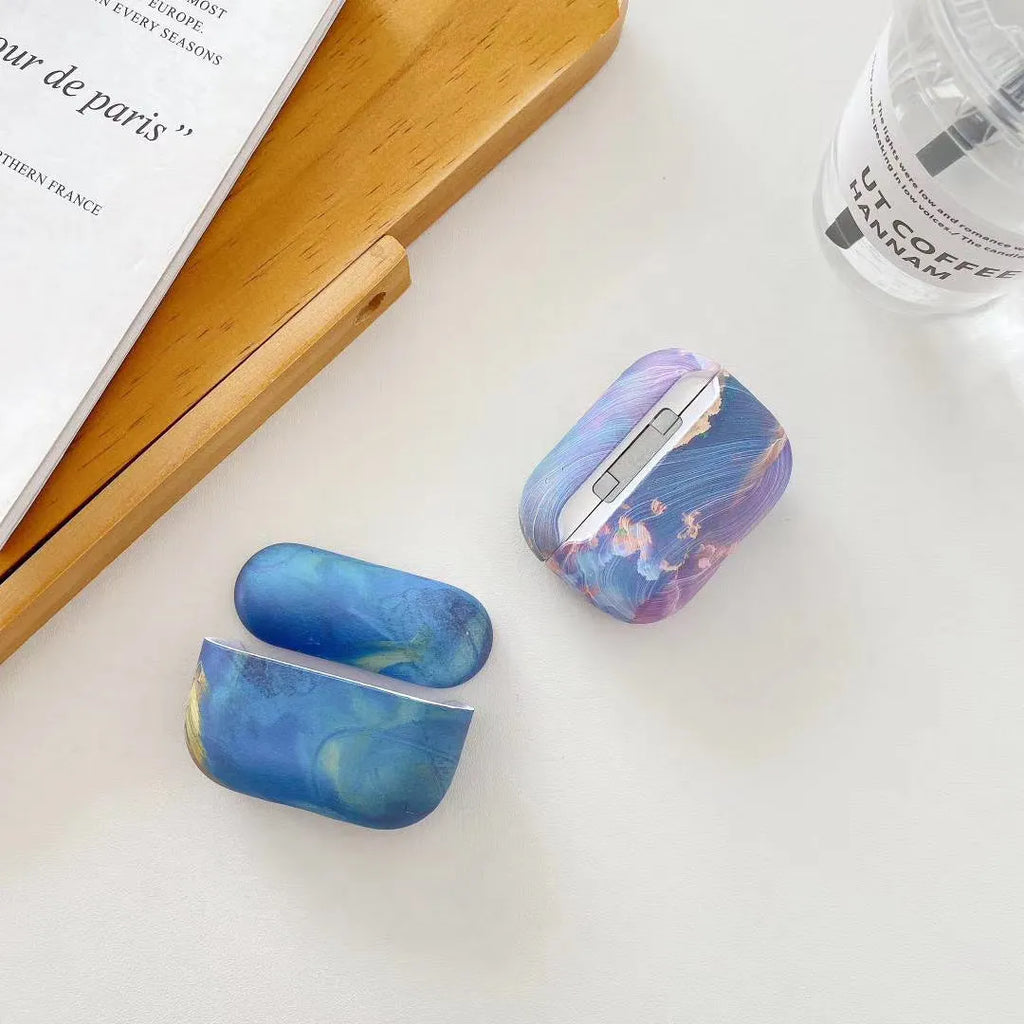 Hard plastic protective sleeve for AirPods Pro case in a blue watercolour design.