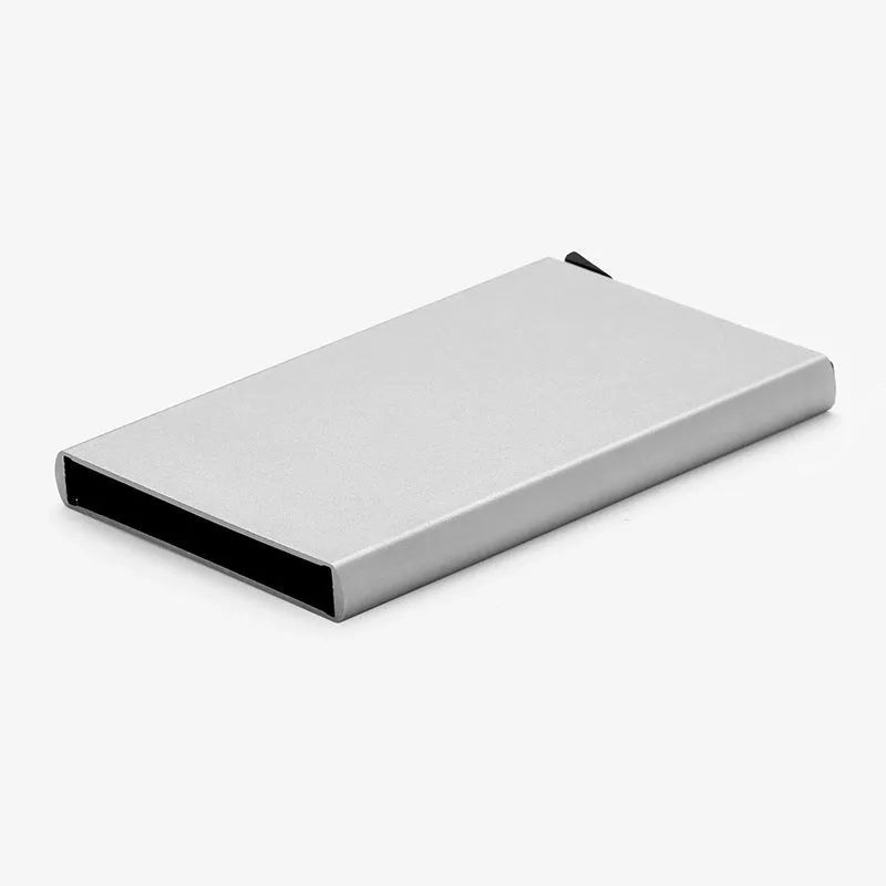 Aluminium geometric business card holder in metallic colours on desk